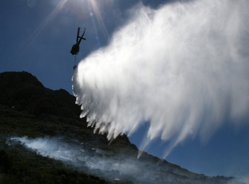 Fire chopper drops water onto the mountain